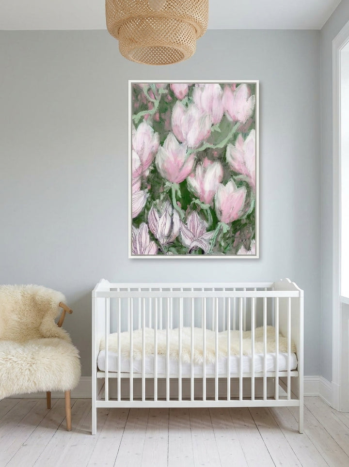 Canvas wall art with a white surround styled on the wall in a bright Scandinavian nursery