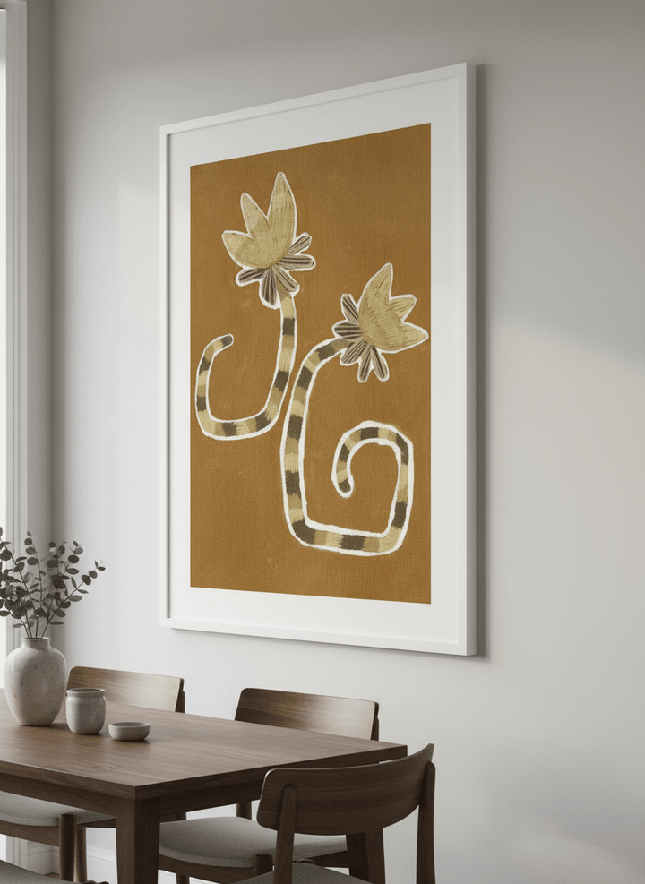Wall art styled above a dining table in a contemporary home