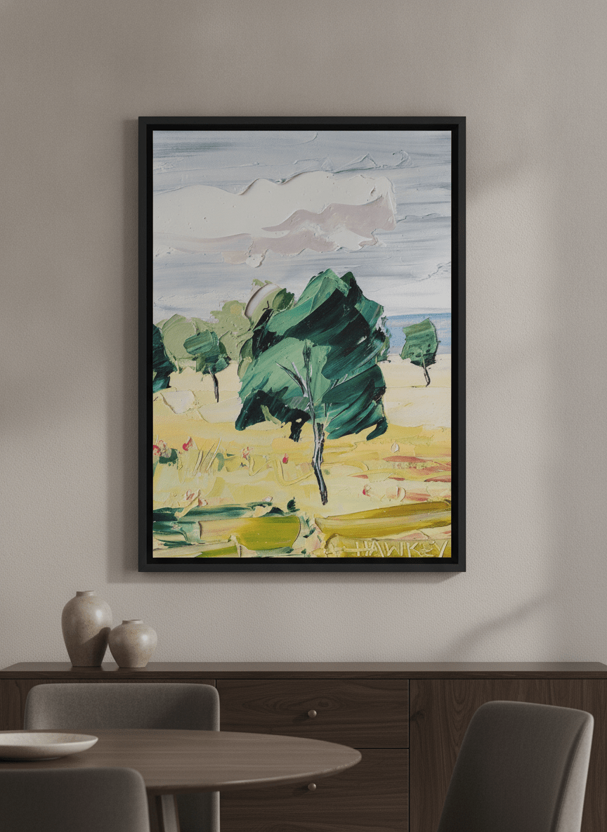 Wall art styled above a dining table in a contemporary home