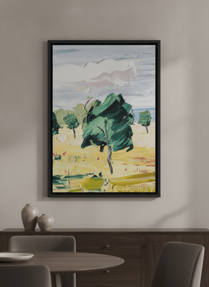 Wall art styled above a dining table in a contemporary home