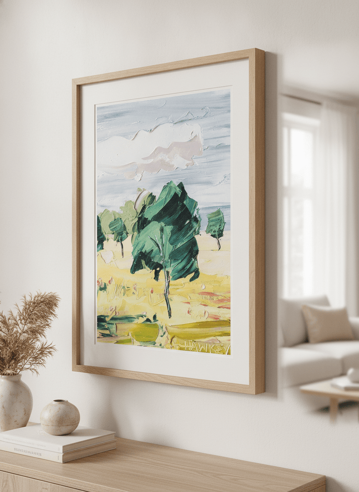 Modern wall art styled above a sofa in a neutral living room
