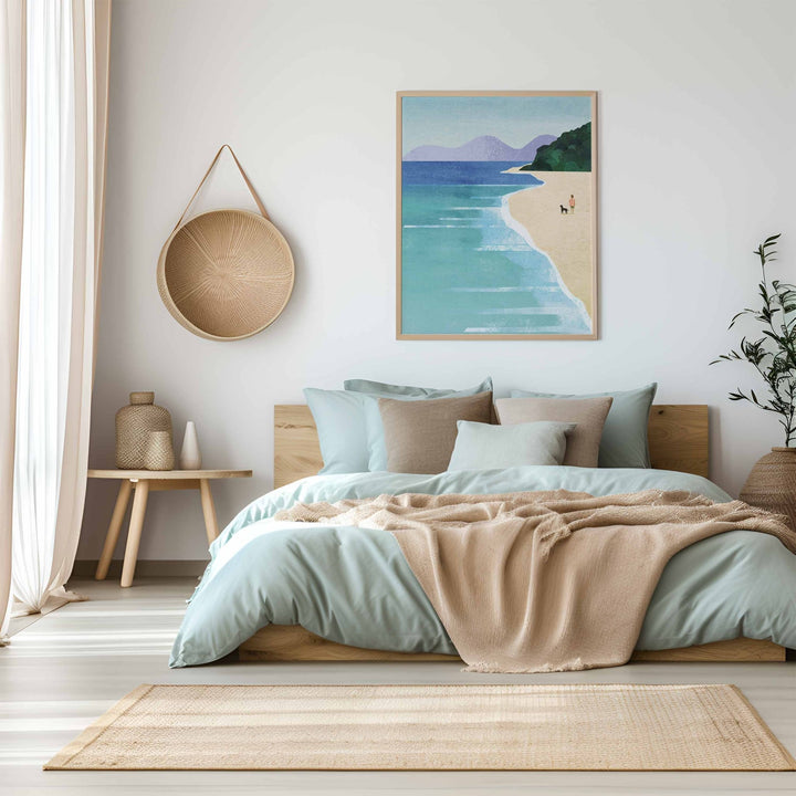 Cozy bedroom with a bed, artwork of a beach scene, and decorative items.