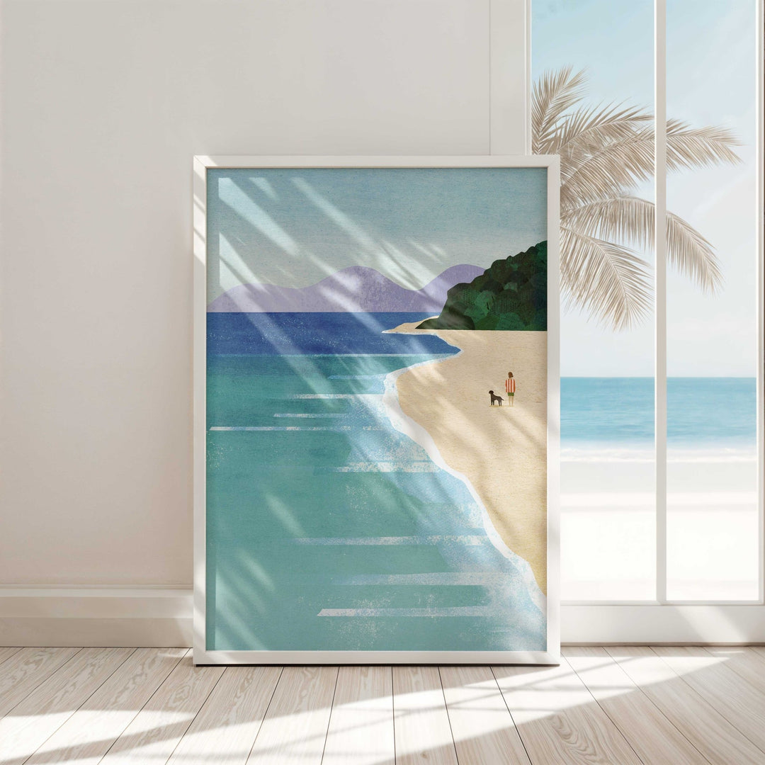 Artwork of a beach scene with a palm tree on a wall.
