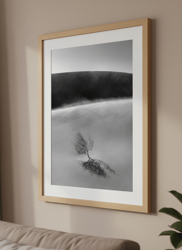 Modern wall art styled above a sofa in a neutral living room