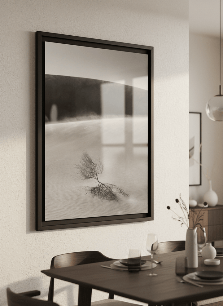 Wall art styled above a dining table in a contemporary home