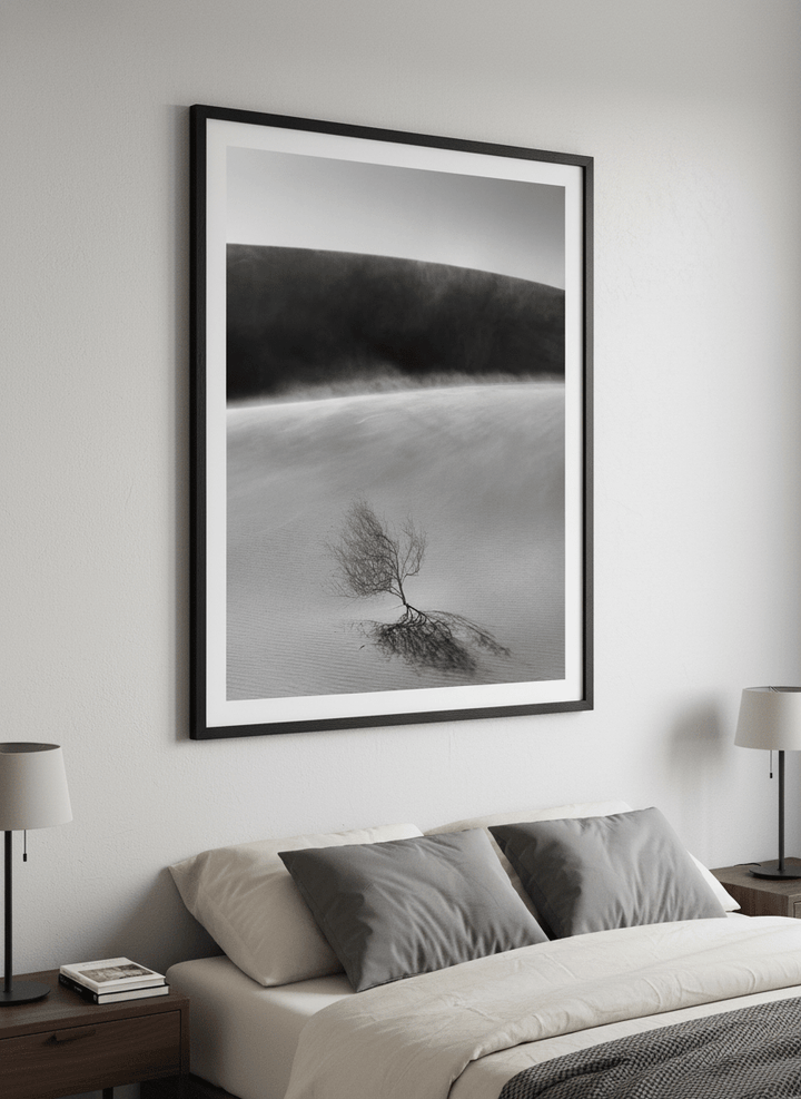 Minimalist artwork displayed in a calm, light-filled bedroom interior