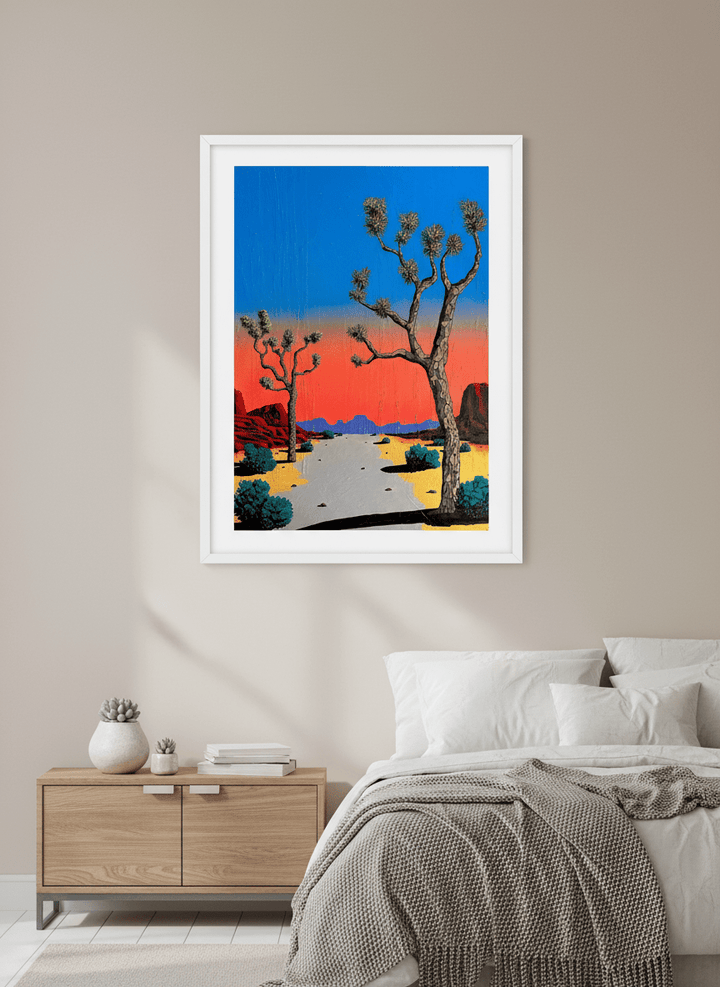 Minimalist artwork displayed in a calm, light-filled bedroom interior