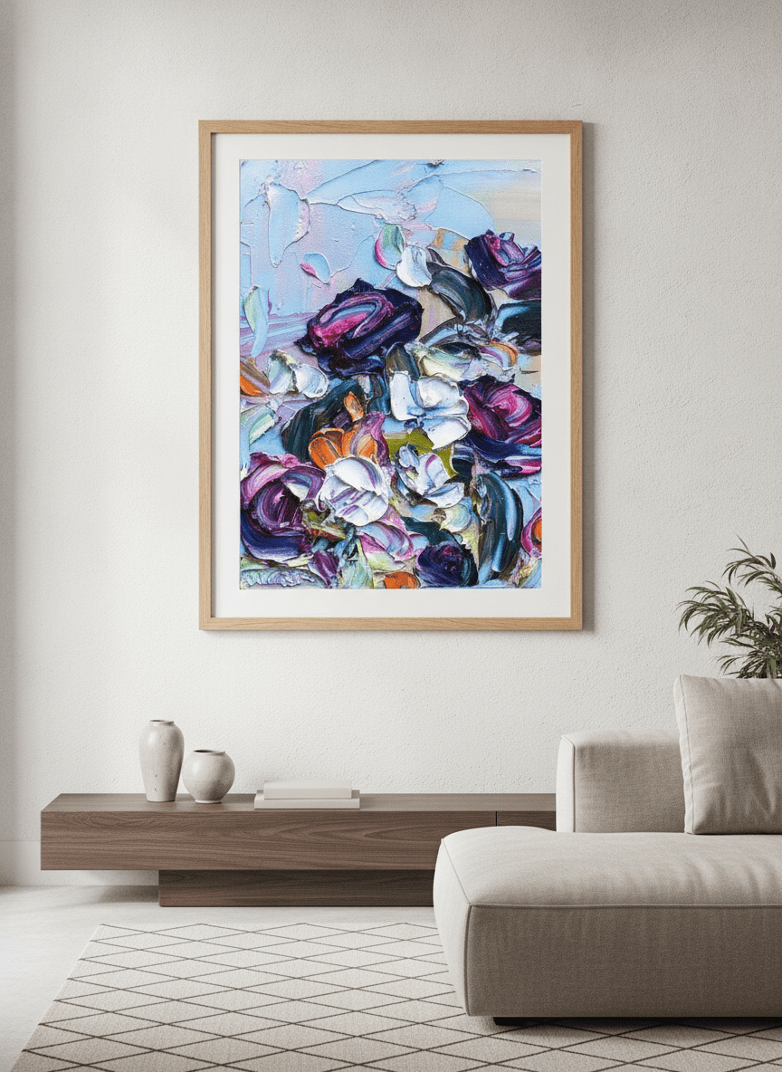 Modern wall art styled above a sofa in a neutral living room