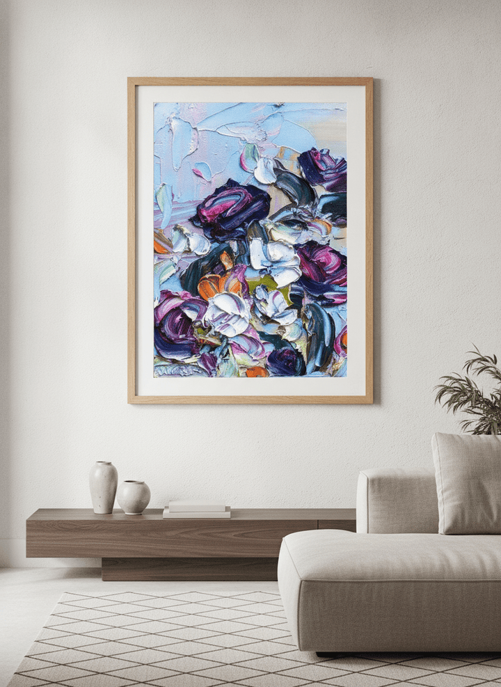 Modern wall art styled above a sofa in a neutral living room