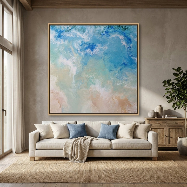 Oversized statement canvas wall art with a natural timber surround styled in a neutral living room