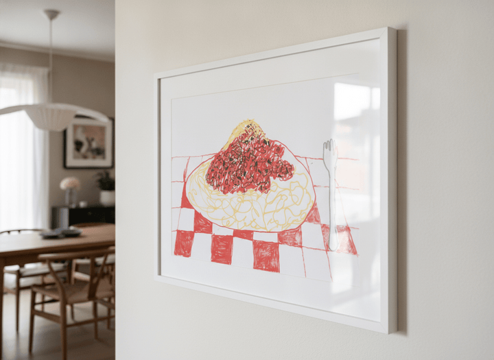 Wall art styled above a dining table in a contemporary home