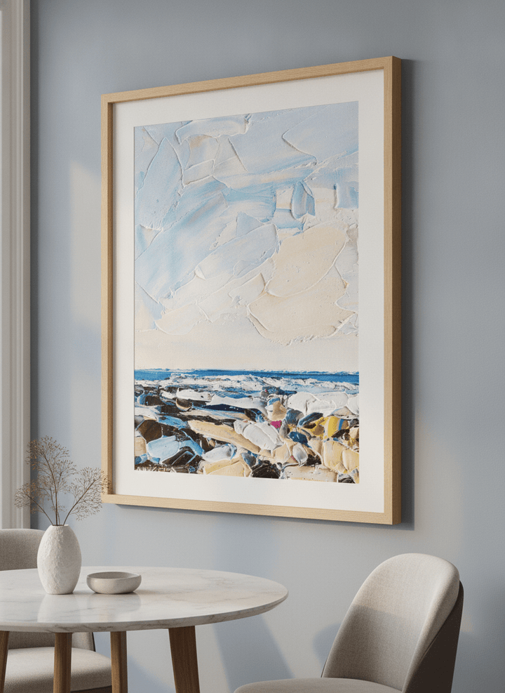 Wall art styled above a dining table in a contemporary home