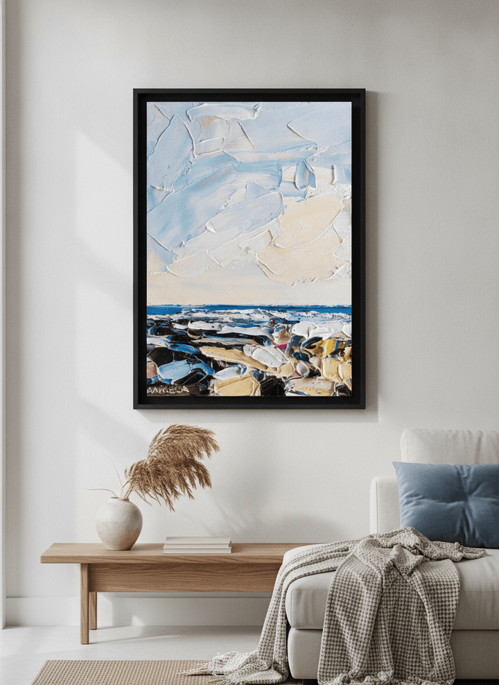 Modern wall art styled above a sofa in a neutral living room