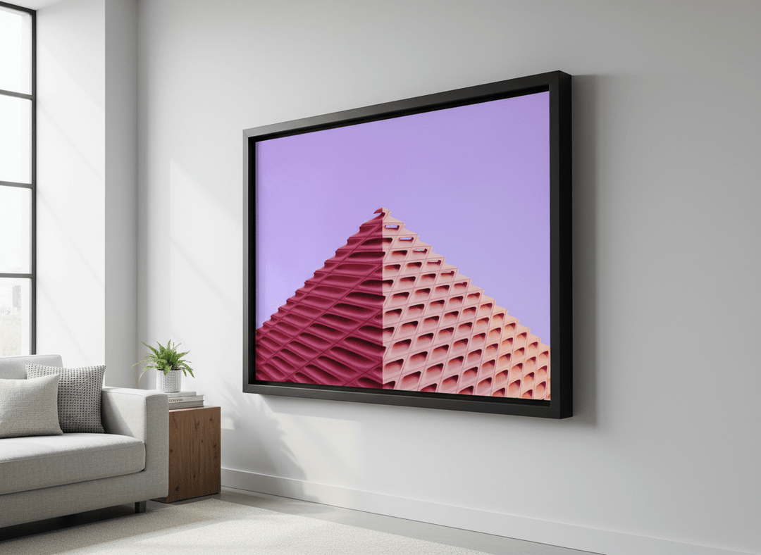 Modern wall art styled above a sofa in a neutral living room