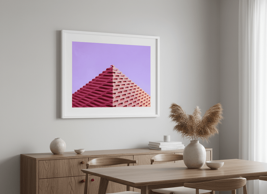 Wall art styled above a dining table in a contemporary home