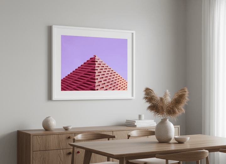 Wall art styled above a dining table in a contemporary home