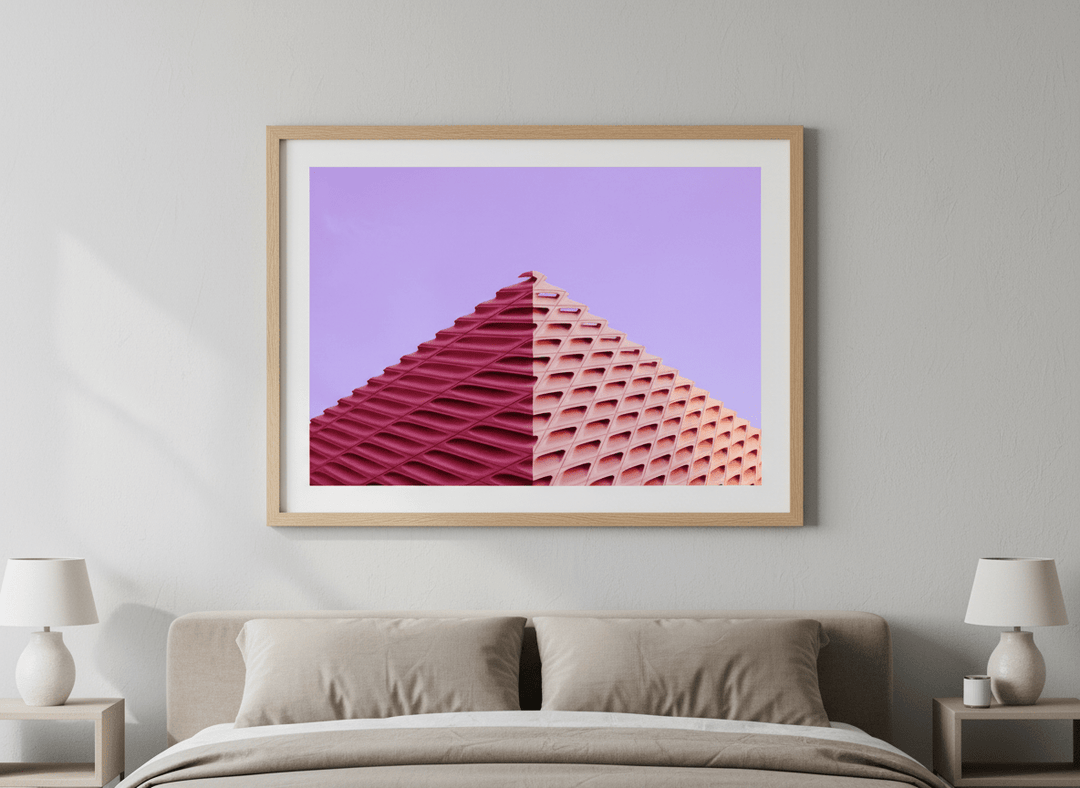 Minimalist artwork displayed in a calm, light-filled bedroom interior