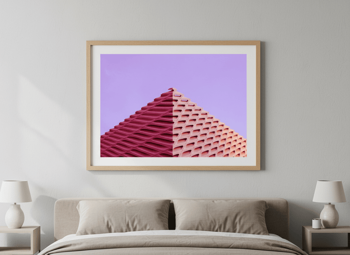 Minimalist artwork displayed in a calm, light-filled bedroom interior
