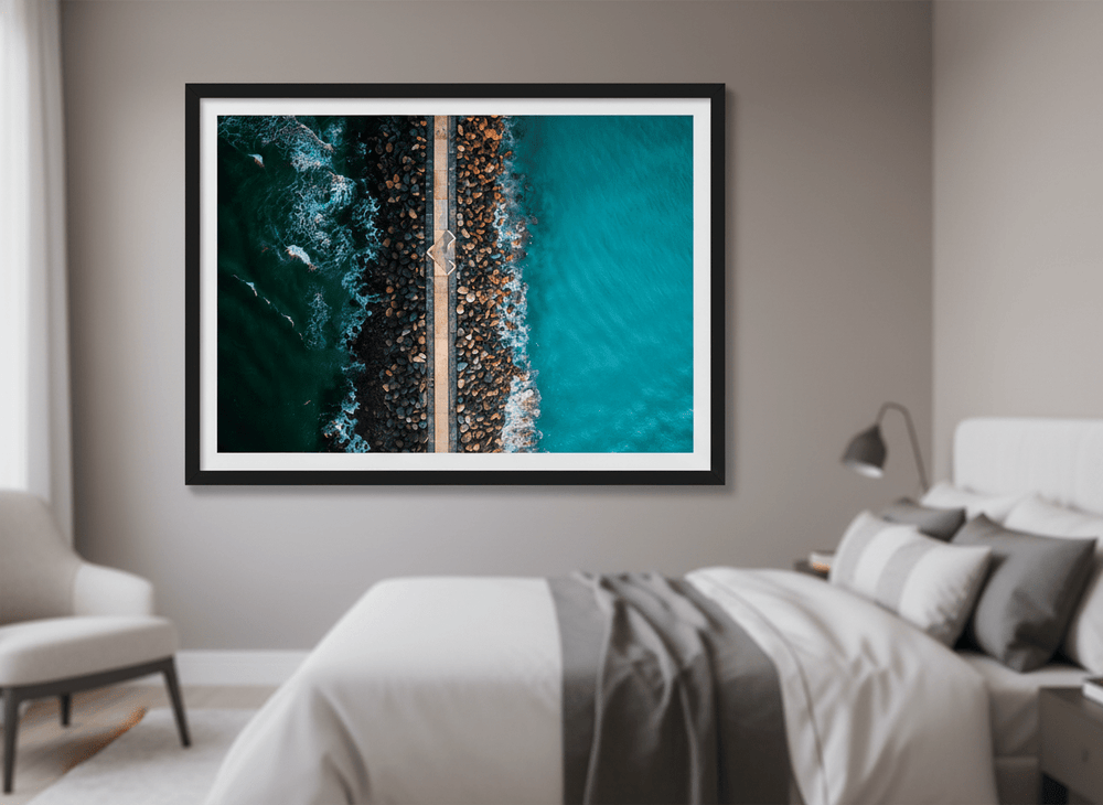 Minimalist artwork displayed in a calm, light-filled bedroom interior