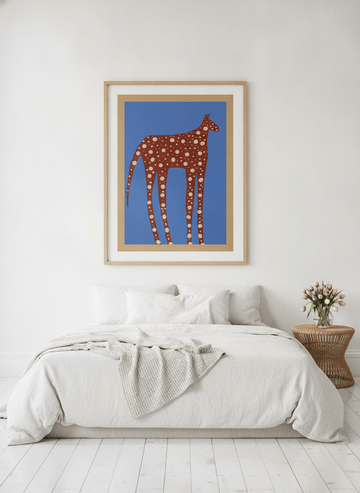 Oversized statement modern wall art print styled on the wall in a bright Scandinavian bedroom