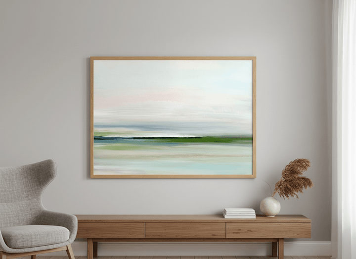 Modern wall art styled above a sofa in a neutral living room