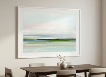 Wall art styled above a dining table in a contemporary home