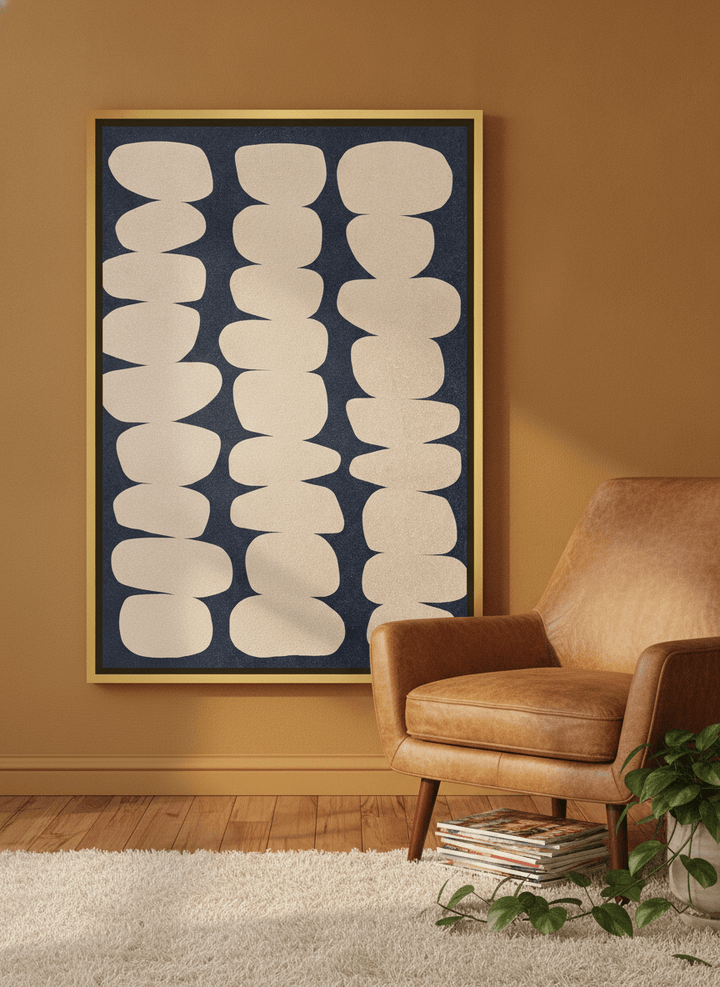 Canvas wall art with a gold leaf surround leaning against the wall in a retro 70s living room