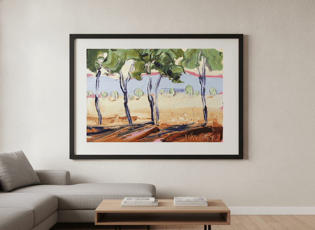 Modern wall art styled above a sofa in a neutral living room
