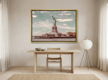Canvas wall art with a gold leaf surround styled on the wall in a warm Japandi home office