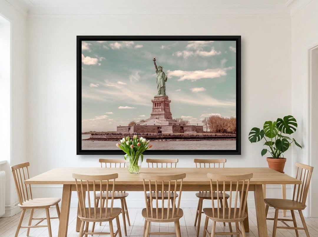 Oversized statement canvas wall art with a black surround styled on the wall in a bright Scandinavian dining room