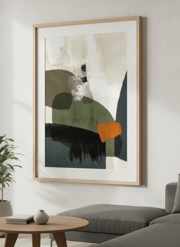 Modern wall art styled above a sofa in a neutral living room
