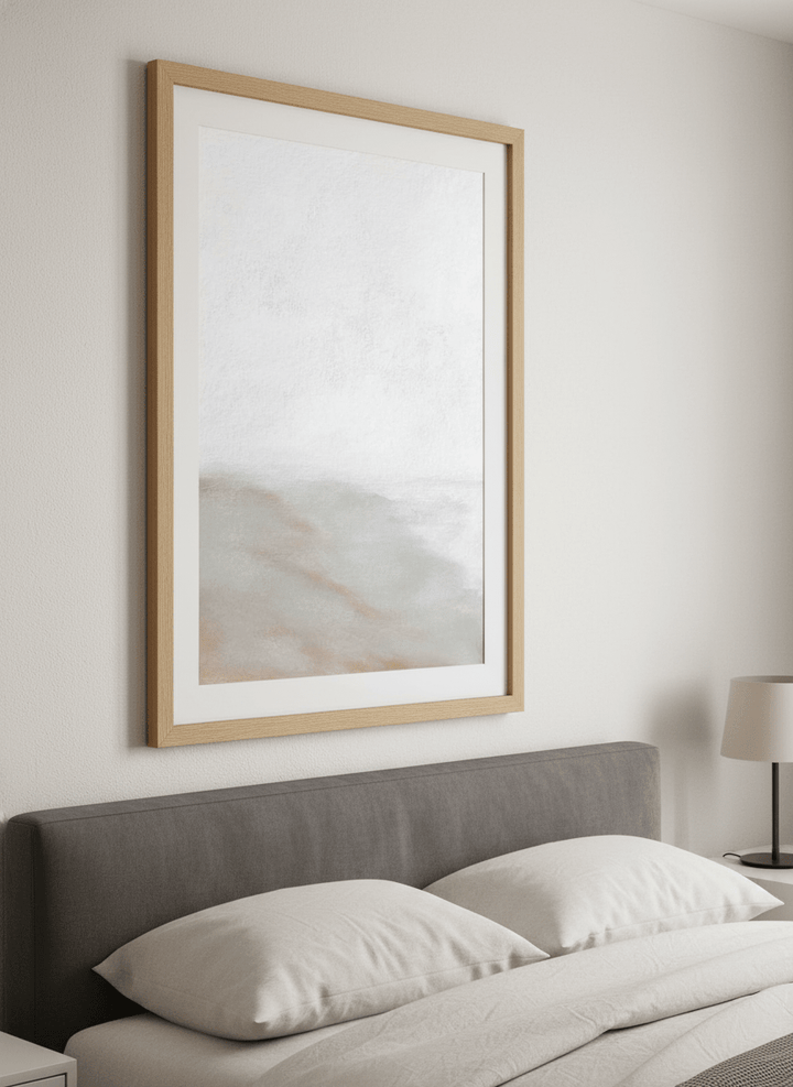 Minimalist artwork displayed in a calm, light-filled bedroom interior