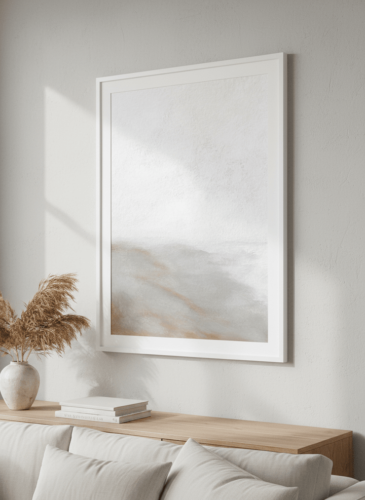 Modern wall art styled above a sofa in a neutral living room