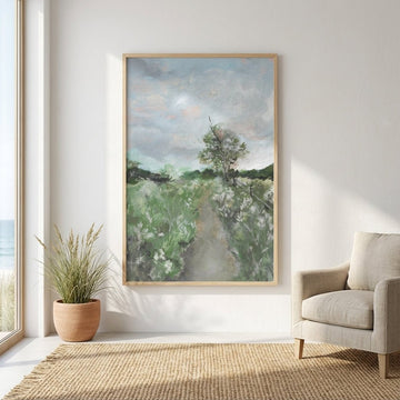 landscape painting on a wall in a room with a chair and plant.