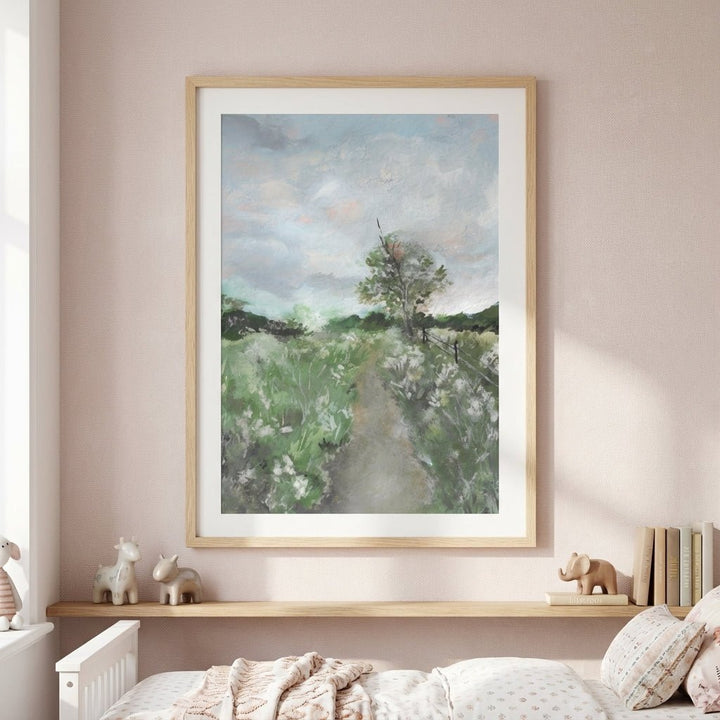 landscape painting on a wall above a bed with decorative items.