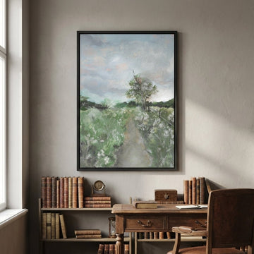 landscape painting above a wooden desk with books in a room.