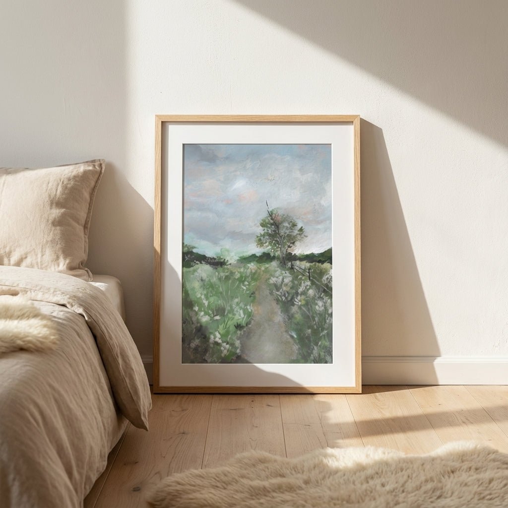 Landscape painting on a wall in a bedroom with natural light