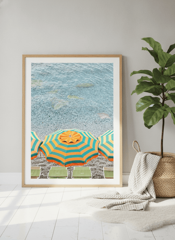 Modern wall art print leaning against the wall in a bright Scandinavian bathroom