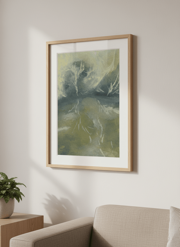 Modern wall art styled above a sofa in a neutral living room