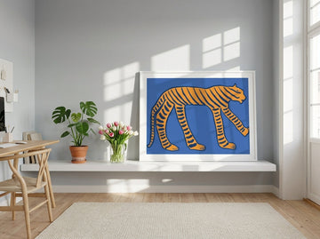 Modern wall art print standing on a shelf in a bright Scandinavian home office