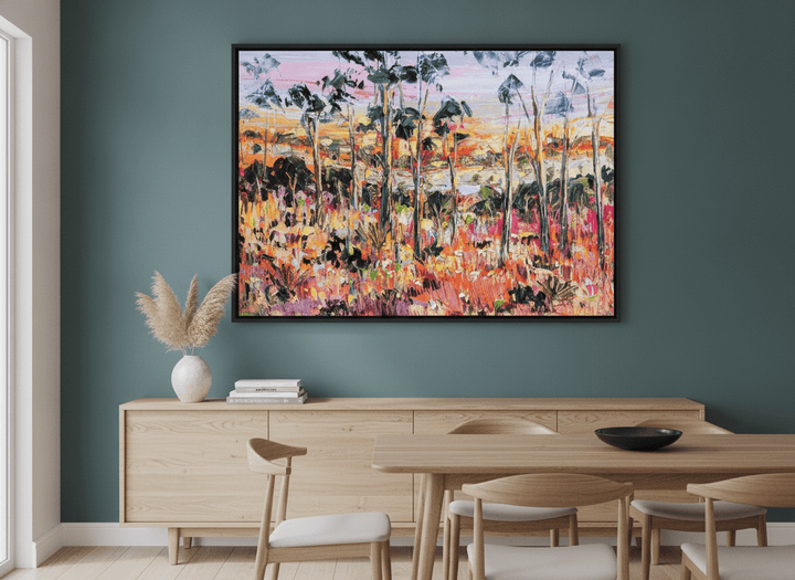 Wall art styled above a dining table in a contemporary home
