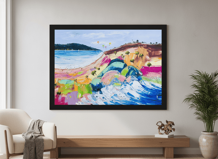Modern wall art styled above a sofa in a neutral living room