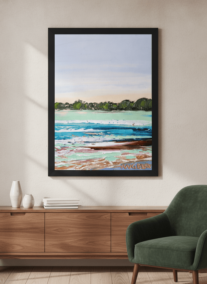 Modern wall art styled above a sofa in a neutral living room