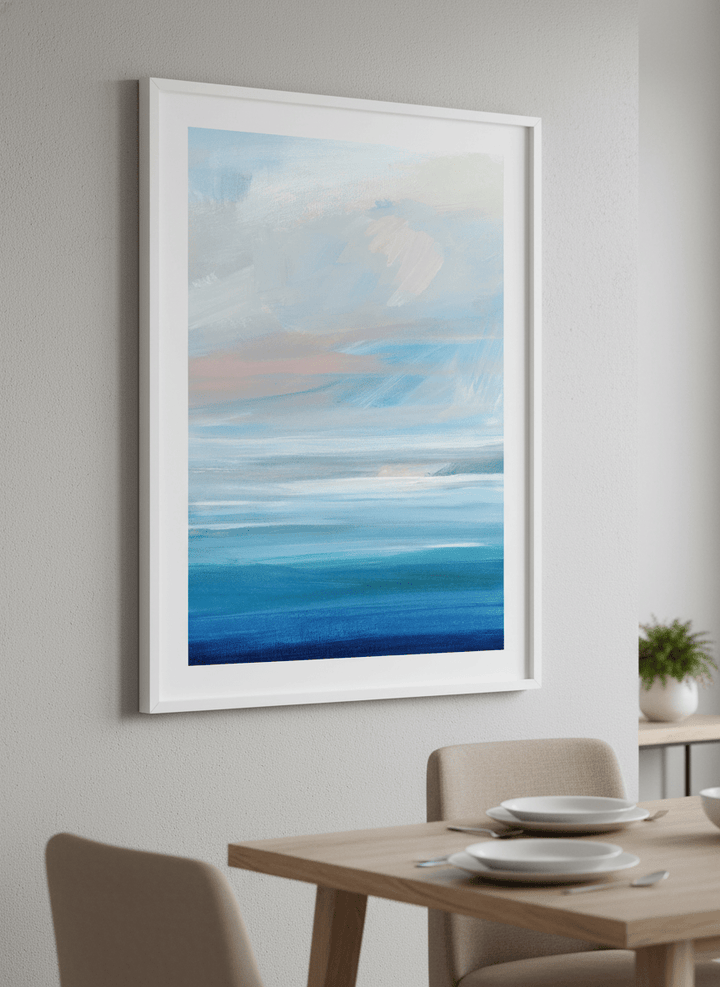 Wall art styled above a dining table in a contemporary home