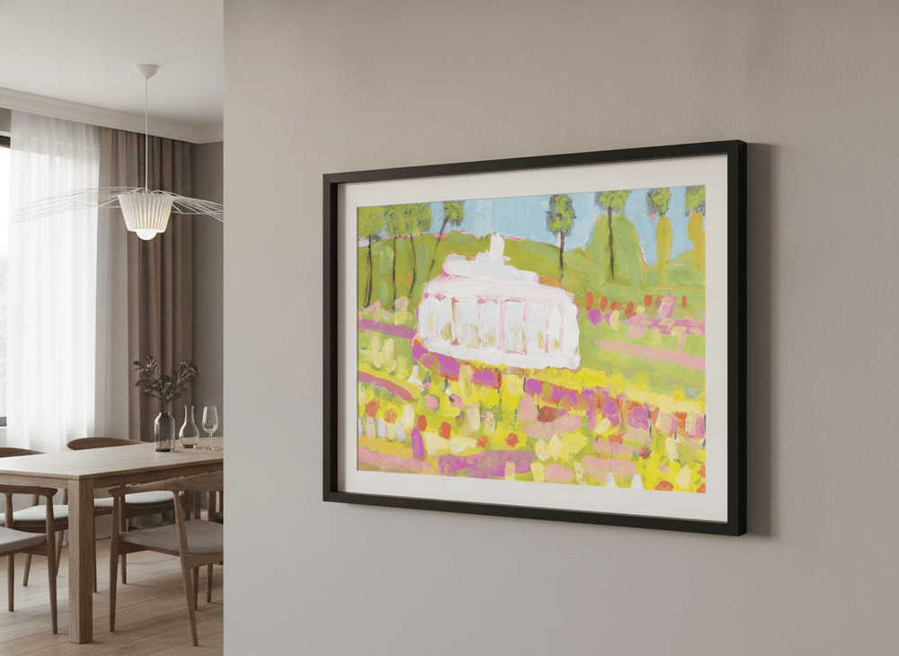 Wall art styled above a dining table in a contemporary home