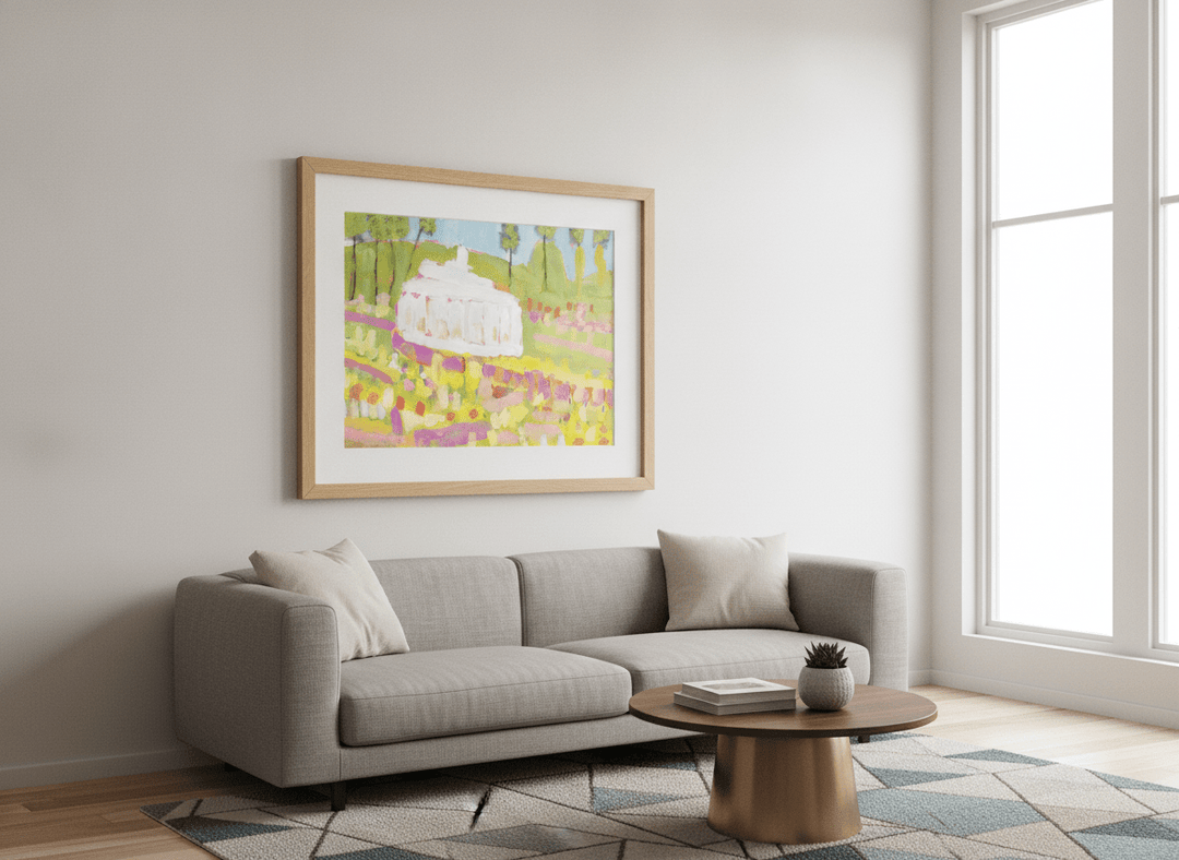 Modern wall art styled above a sofa in a neutral living room