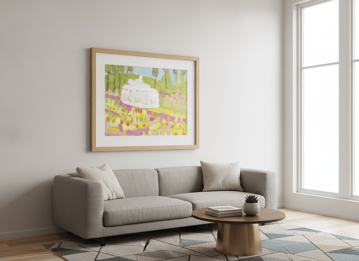 Modern wall art styled above a sofa in a neutral living room