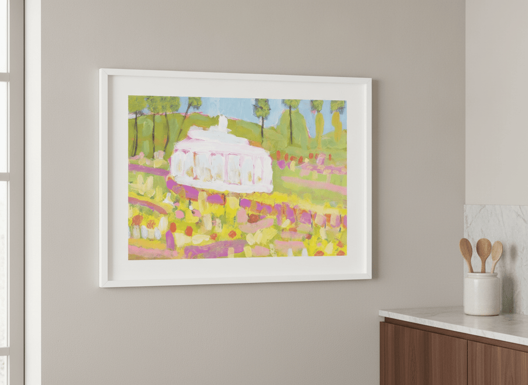 Artwork styled on the wall of a bright modern kitchen