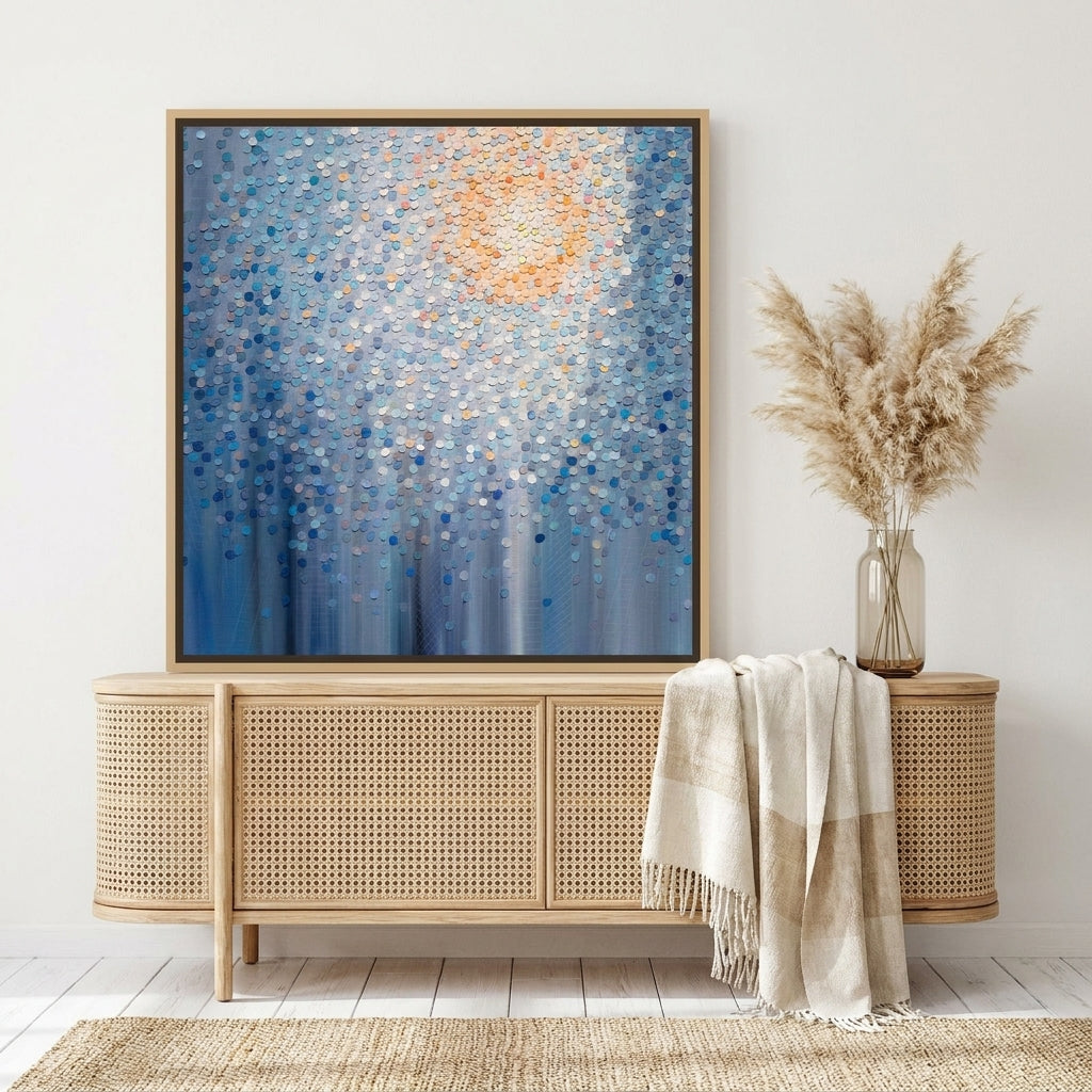 Canvas wall art with a natural timber surround standing on a sideboard in a coastal bedroom