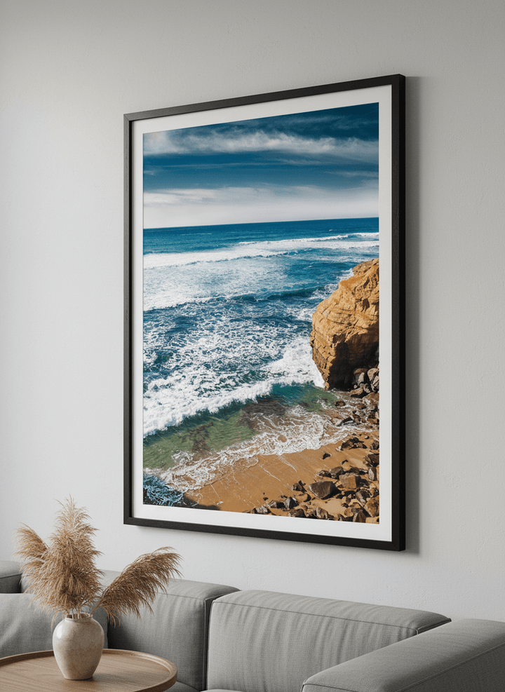 Modern wall art styled above a sofa in a neutral living room